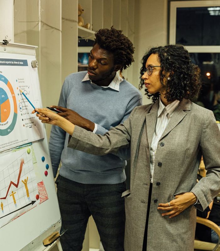 Team collaboration session with professionals analyzing complex data structures